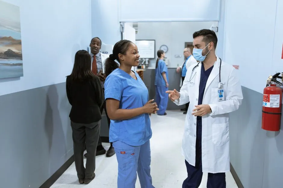 Allied health practitioners in a clinical setting discussing patient care